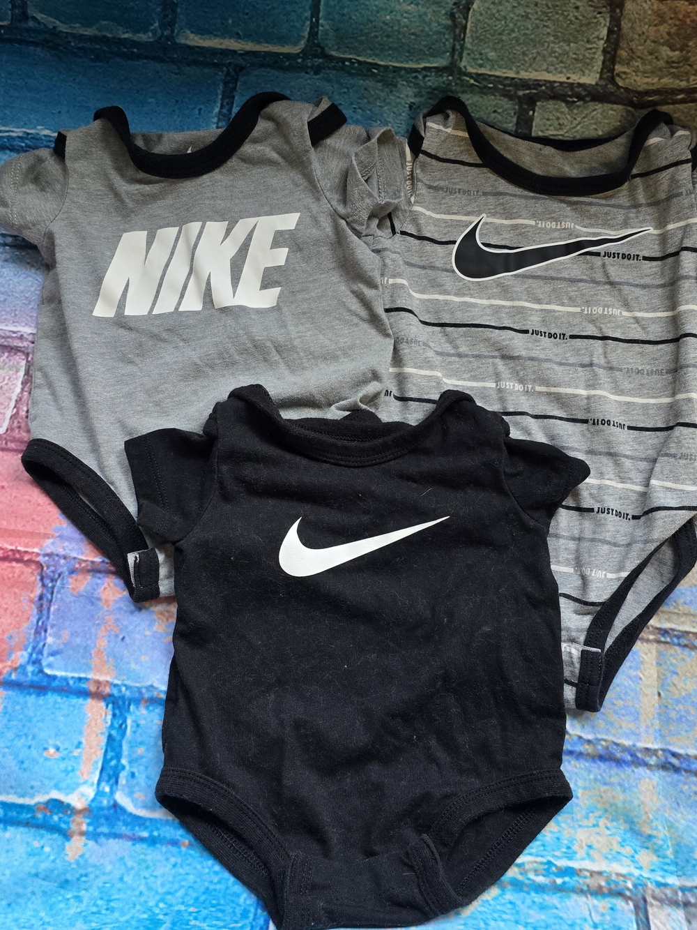 Nike Baby Onesie Trio in Black & Gray